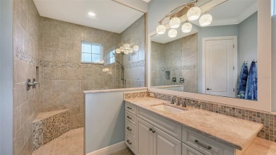 Positioned on a premier homesite with water on two sides and on Ritz-Carlton Members Golf Club in Florida - for sale on GolfHomes.com, golf home, golf lot