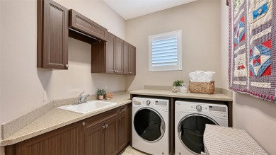 Positioned on a premier homesite with water on two sides and on Ritz-Carlton Members Golf Club in Florida - for sale on GolfHomes.com, golf home, golf lot