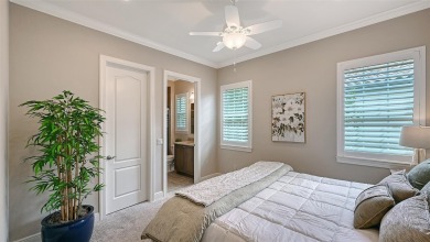 Positioned on a premier homesite with water on two sides and on Ritz-Carlton Members Golf Club in Florida - for sale on GolfHomes.com, golf home, golf lot