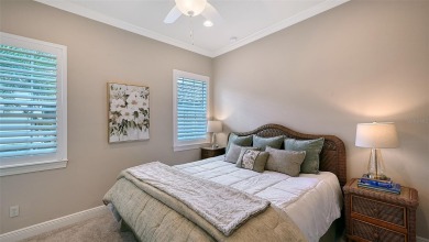 Positioned on a premier homesite with water on two sides and on Ritz-Carlton Members Golf Club in Florida - for sale on GolfHomes.com, golf home, golf lot