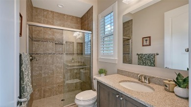 Positioned on a premier homesite with water on two sides and on Ritz-Carlton Members Golf Club in Florida - for sale on GolfHomes.com, golf home, golf lot