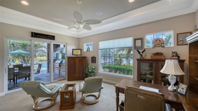 Positioned on a premier homesite with water on two sides and on Ritz-Carlton Members Golf Club in Florida - for sale on GolfHomes.com, golf home, golf lot