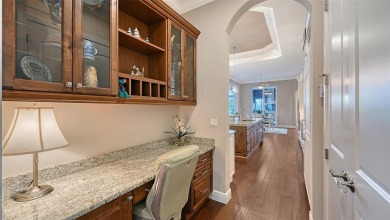 Positioned on a premier homesite with water on two sides and on Ritz-Carlton Members Golf Club in Florida - for sale on GolfHomes.com, golf home, golf lot