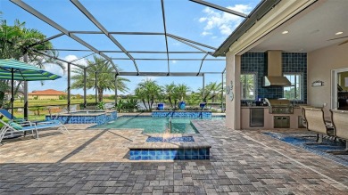 Positioned on a premier homesite with water on two sides and on Ritz-Carlton Members Golf Club in Florida - for sale on GolfHomes.com, golf home, golf lot