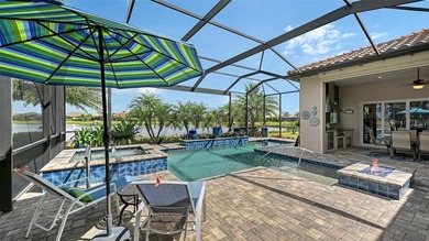 Positioned on a premier homesite with water on two sides and on Ritz-Carlton Members Golf Club in Florida - for sale on GolfHomes.com, golf home, golf lot