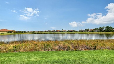 Positioned on a premier homesite with water on two sides and on Ritz-Carlton Members Golf Club in Florida - for sale on GolfHomes.com, golf home, golf lot