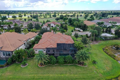 Positioned on a premier homesite with water on two sides and on Ritz-Carlton Members Golf Club in Florida - for sale on GolfHomes.com, golf home, golf lot