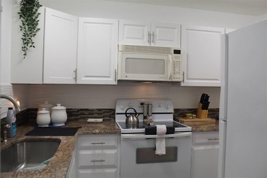 Welcome to this charming 2-bedroom, 2.5-bath condominium located on Errol Estates Country Club in Florida - for sale on GolfHomes.com, golf home, golf lot