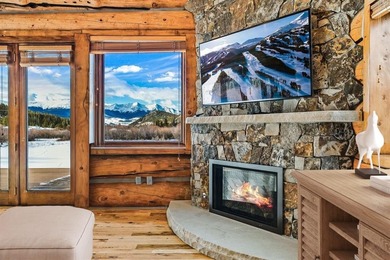 Set on 14 pristine acres along the Swan River, 2717 Tiger Road on Breckenridge Golf Club in Colorado - for sale on GolfHomes.com, golf home, golf lot