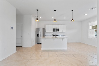 Situated on a corner lot, this contemporary two-story home with on Venetian Bay Golf Course in Florida - for sale on GolfHomes.com, golf home, golf lot