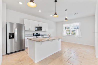 Situated on a corner lot, this contemporary two-story home with on Venetian Bay Golf Course in Florida - for sale on GolfHomes.com, golf home, golf lot