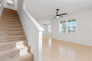 Situated on a corner lot, this contemporary two-story home with on Venetian Bay Golf Course in Florida - for sale on GolfHomes.com, golf home, golf lot