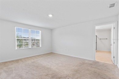 Situated on a corner lot, this contemporary two-story home with on Venetian Bay Golf Course in Florida - for sale on GolfHomes.com, golf home, golf lot