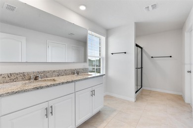 Situated on a corner lot, this contemporary two-story home with on Venetian Bay Golf Course in Florida - for sale on GolfHomes.com, golf home, golf lot