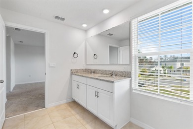 Situated on a corner lot, this contemporary two-story home with on Venetian Bay Golf Course in Florida - for sale on GolfHomes.com, golf home, golf lot