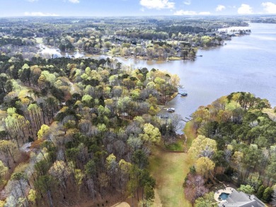 Introducing your exclusive lakeside retreat at Lake Oconee's on Great Waters Course At Reynolds Plantation in Georgia - for sale on GolfHomes.com, golf home, golf lot