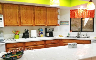 This stunning furnished 2-bedroom, 2-bath condo in Residential on London Bridge Golf Course in Arizona - for sale on GolfHomes.com, golf home, golf lot
