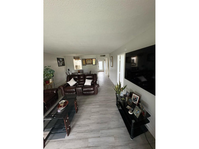 WOW!!! RARELY AVAILABLE REMODLED GROUND FLOOR CORNER UNIT on  in Florida - for sale on GolfHomes.com, golf home, golf lot