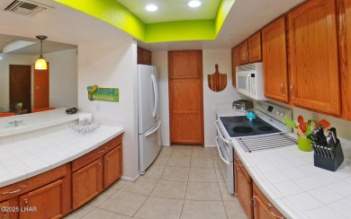 This stunning furnished 2-bedroom, 2-bath condo in Residential on London Bridge Golf Course in Arizona - for sale on GolfHomes.com, golf home, golf lot