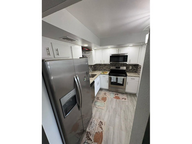 WOW!!! RARELY AVAILABLE REMODLED GROUND FLOOR CORNER UNIT on  in Florida - for sale on GolfHomes.com, golf home, golf lot