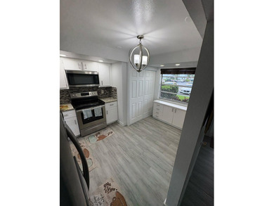 WOW!!! RARELY AVAILABLE REMODLED GROUND FLOOR CORNER UNIT on  in Florida - for sale on GolfHomes.com, golf home, golf lot