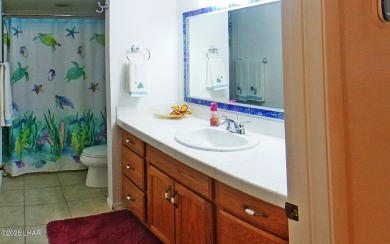 This stunning furnished 2-bedroom, 2-bath condo in Residential on London Bridge Golf Course in Arizona - for sale on GolfHomes.com, golf home, golf lot