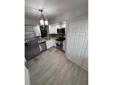 WOW!!! RARELY AVAILABLE REMODLED GROUND FLOOR CORNER UNIT on  in Florida - for sale on GolfHomes.com, golf home, golf lot