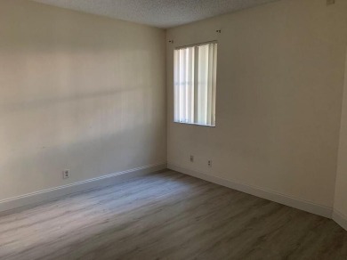 Specious 2 bed 2 bath ground floor unit with beautiful lake view on Palm-Aire Country Club and Resort - Palms in Florida - for sale on GolfHomes.com, golf home, golf lot