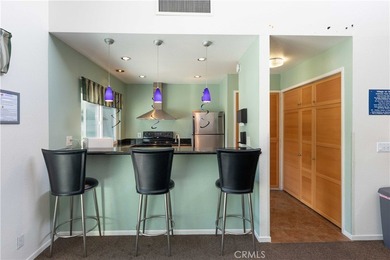 This charming one-bedroom corner unit in the gated Bixby Village on Bixby Village Golf Course in California - for sale on GolfHomes.com, golf home, golf lot