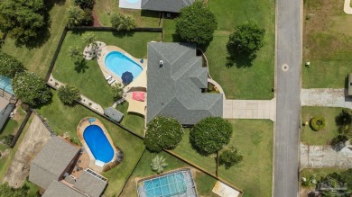 Welcome to your dream home at 3849 Saber Tooth Circle, nestled on Tiger Point Golf and Country Club in Florida - for sale on GolfHomes.com, golf home, golf lot