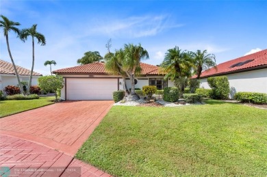 Welcome to your retreat in Boca Raton! This single-story home on Boca Woods Country Club in Florida - for sale on GolfHomes.com, golf home, golf lot