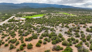 Nestled by a pristine golf course in the heart of a mountain on Paa-Ko Ridge Golf Club  in New Mexico - for sale on GolfHomes.com, golf home, golf lot