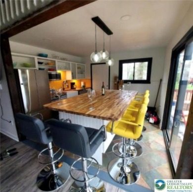 Don't let the outside fool you, this home feels more spacious on Pocono Farms Country Club in Pennsylvania - for sale on GolfHomes.com, golf home, golf lot