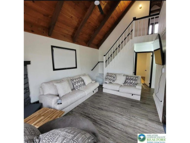 Don't let the outside fool you, this home feels more spacious on Pocono Farms Country Club in Pennsylvania - for sale on GolfHomes.com, golf home, golf lot