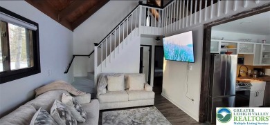 Don't let the outside fool you, this home feels more spacious on Pocono Farms Country Club in Pennsylvania - for sale on GolfHomes.com, golf home, golf lot