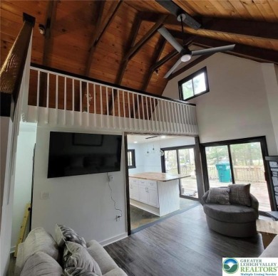 Don't let the outside fool you, this home feels more spacious on Pocono Farms Country Club in Pennsylvania - for sale on GolfHomes.com, golf home, golf lot