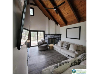 Don't let the outside fool you, this home feels more spacious on Pocono Farms Country Club in Pennsylvania - for sale on GolfHomes.com, golf home, golf lot
