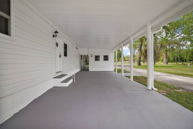 New roof, new vinyl siding, new vinyl windows, newer HVAC and on Rolling Greens Executive Golf Community in Florida - for sale on GolfHomes.com, golf home, golf lot