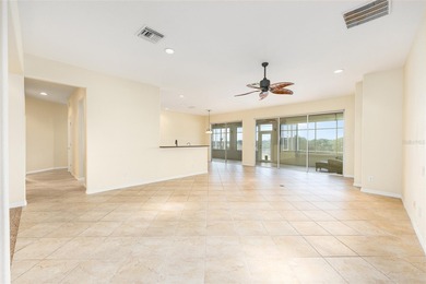 This distinguished Johnstown model features remarkable sunsets on Eagle Ridge At Spruce Creek Country Club in Florida - for sale on GolfHomes.com, golf home, golf lot