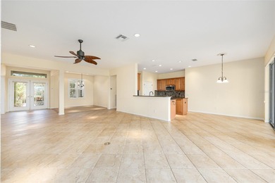 This distinguished Johnstown model features remarkable sunsets on Eagle Ridge At Spruce Creek Country Club in Florida - for sale on GolfHomes.com, golf home, golf lot