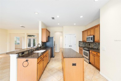 This distinguished Johnstown model features remarkable sunsets on Eagle Ridge At Spruce Creek Country Club in Florida - for sale on GolfHomes.com, golf home, golf lot