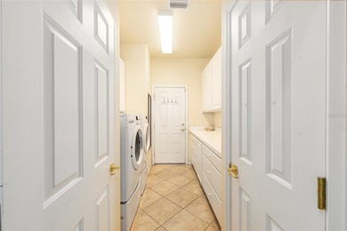 This distinguished Johnstown model features remarkable sunsets on Eagle Ridge At Spruce Creek Country Club in Florida - for sale on GolfHomes.com, golf home, golf lot