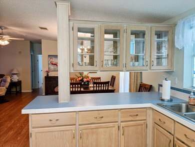 This spacious 3 bdrm,2 bath PALM HARBOR is completely furnished on Southport Springs Golf Club in Florida - for sale on GolfHomes.com, golf home, golf lot