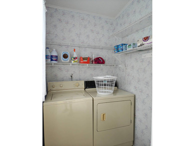 This spacious 3 bdrm,2 bath PALM HARBOR is completely furnished on Southport Springs Golf Club in Florida - for sale on GolfHomes.com, golf home, golf lot