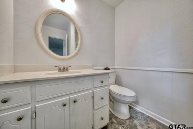 This lovely single-story home combines comfort, style, and on Hide-A-Way Lake Golf Course in Texas - for sale on GolfHomes.com, golf home, golf lot