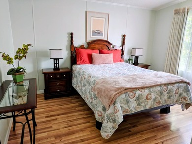 This spacious 3 bdrm,2 bath PALM HARBOR is completely furnished on Southport Springs Golf Club in Florida - for sale on GolfHomes.com, golf home, golf lot