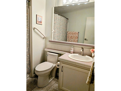 This spacious 3 bdrm,2 bath PALM HARBOR is completely furnished on Southport Springs Golf Club in Florida - for sale on GolfHomes.com, golf home, golf lot