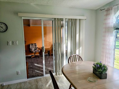 This spacious 3 bdrm,2 bath PALM HARBOR is completely furnished on Southport Springs Golf Club in Florida - for sale on GolfHomes.com, golf home, golf lot