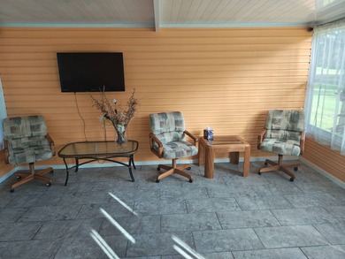 This spacious 3 bdrm,2 bath PALM HARBOR is completely furnished on Southport Springs Golf Club in Florida - for sale on GolfHomes.com, golf home, golf lot