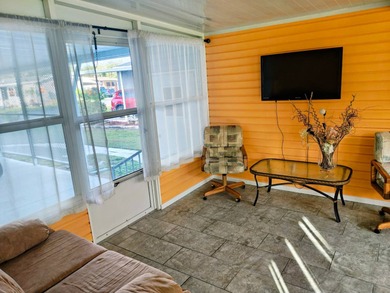 This spacious 3 bdrm,2 bath PALM HARBOR is completely furnished on Southport Springs Golf Club in Florida - for sale on GolfHomes.com, golf home, golf lot